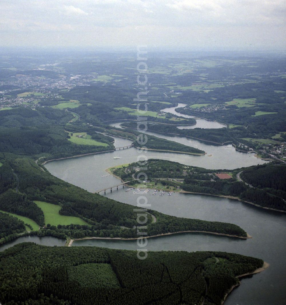 Aerial image Olpe - Blick auf den Biggesee im Kreis Olpe in Nordrhein-Westfalen. Der Biggesee, dessen Staudamm von 1956 bis 1965 entstand, dient der Regulierung von Bigge, Lenne und Ruhr sowie der Wasserversorgung unter an derem des Ruhrgebiets. Im Laufe der Jahre hat sich der Biggesee zu einem beliebten Touristenziel entwickelt. View to the lake Biggesee in the administrative district Olpe of Northrhine-Westphalia. It is a storage lake in Northrhine-Westfalia and serves as a source of water supply. Today it is?????????????????????????????????????????????????????????????