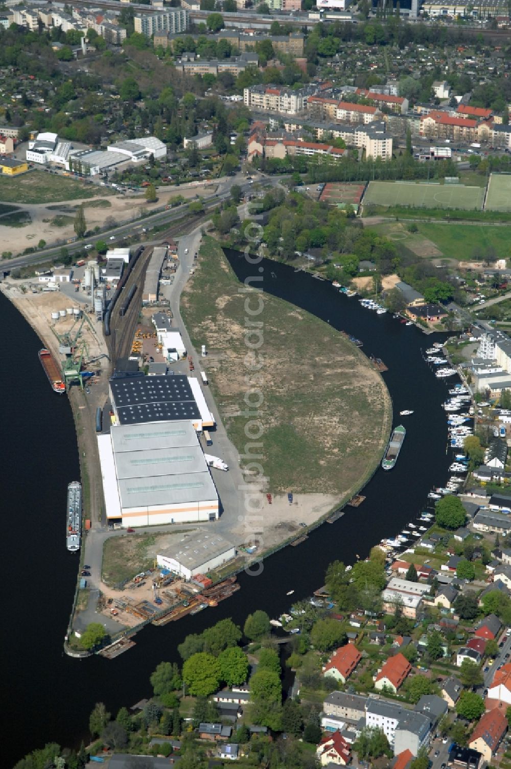 Berlin from above - Wharves and piers with ship loading terminals in the inner harbor Suedhafen on the Havel river in the district Spandau in Berlin, Germany