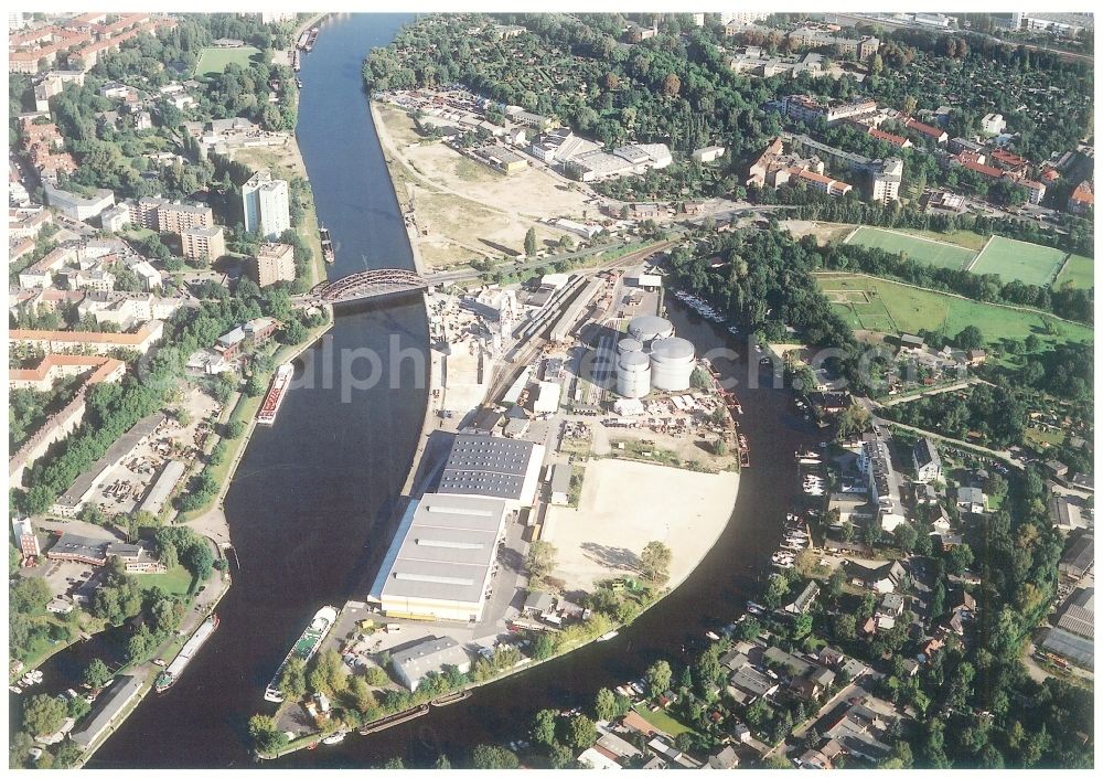 Berlin from above - Wharves and piers with ship loading terminals in the inner harbor Suedhafen on the Havel river in the district Spandau in Berlin, Germany