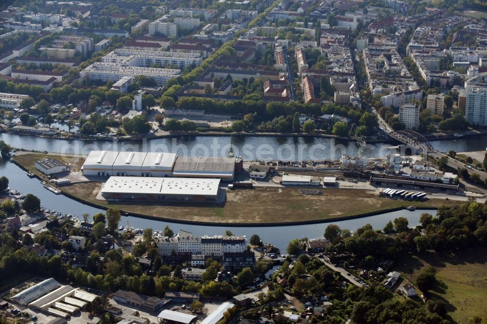 Berlin from above - Wharves and piers with ship loading terminals in the inner harbor Suedhafen on the Havel river in the district Spandau in Berlin, Germany