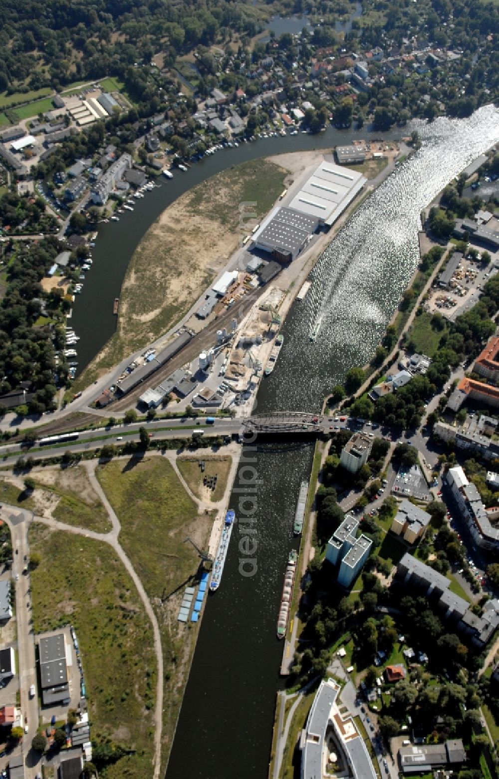 Berlin from above - Wharves and piers with ship loading terminals in the inner harbor Suedhafen on the Havel river in the district Spandau in Berlin, Germany