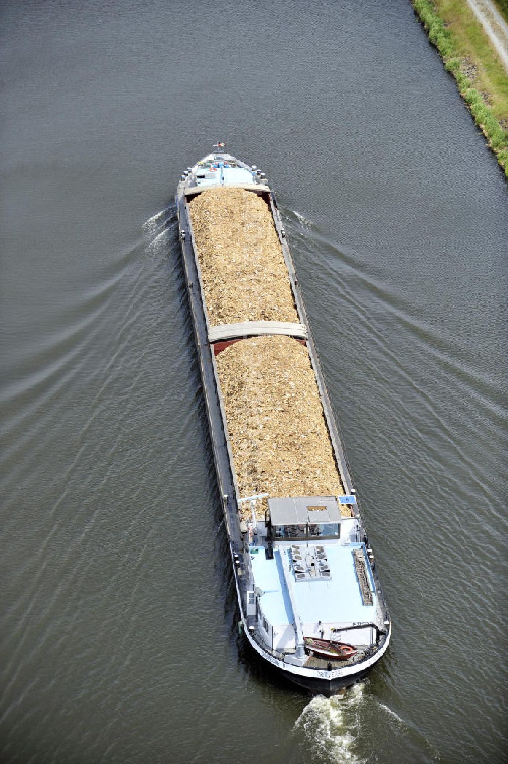 Aerial image Genthin - Blick auf ein Binnenschiff im Güterverkehr auf dem Elbe-Havel-Kanal. View of an inland freight transport on the Elbe-Havel canal.