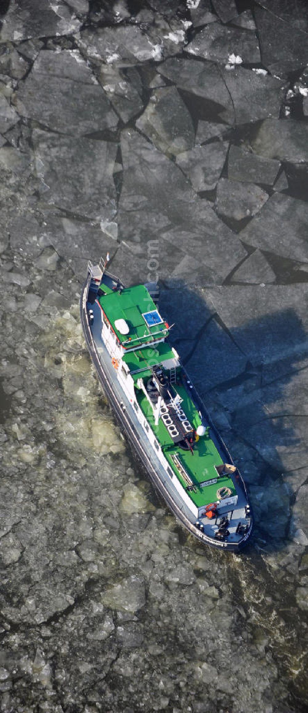 Aerial image Kirchmöser-West - Binnenschiff- Schlepper Eisbär auf dem spätwinterlich mit Treibeis gefrorenen Wendsee in einer Fahrrinne zum angrenzenden Oder-Havel-Kanal. Inland - tug Polar Bearon the late winter with ice frozen Wendsee in a shipping channel adjacent to the Oder-Havel canal.