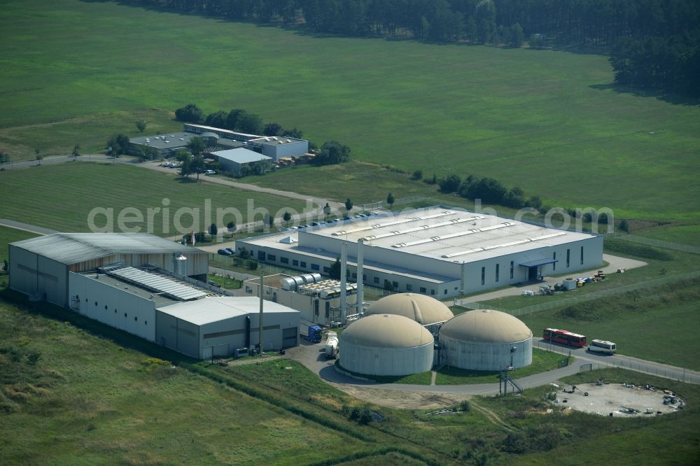 Jessen (Elster) from the bird's eye view: Biogas compound of Agratec in the commercial park of Jessen (Elster) in the state of Saxony-Anhalt. The compound with the tanks and silos is surrounded by fields and meadows