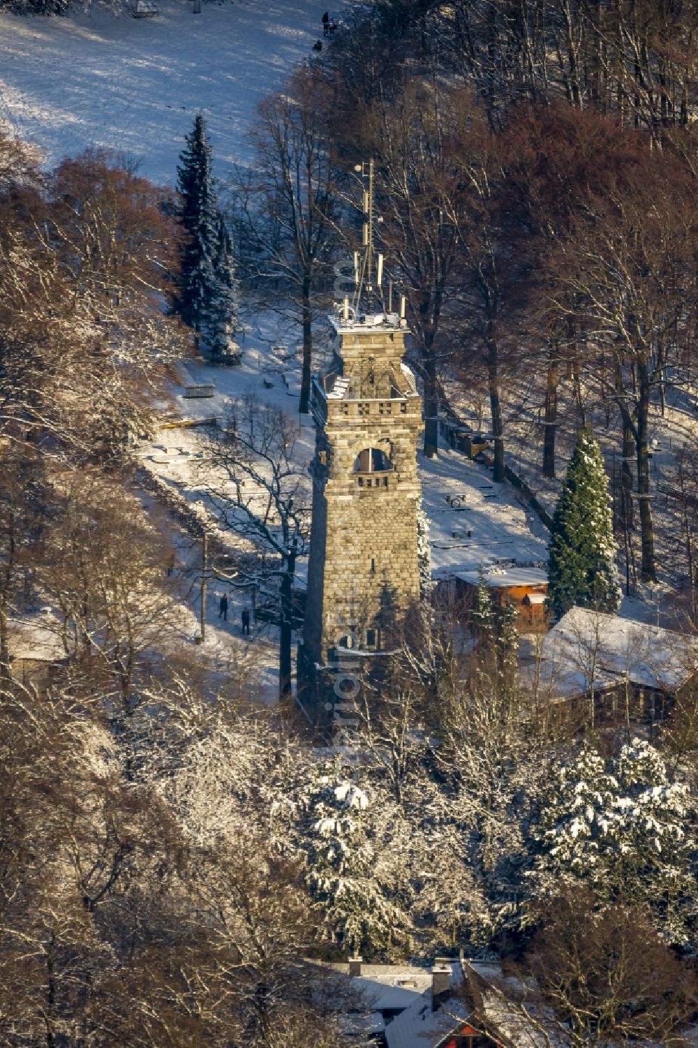 Velbert from above - Bismarck Tower on snow-covered Hordtberg in the Langenberg part of Velbert in the state of North Rhine-Westphalia. The tower was opened in 1906 and later used as a radio tower. A restaurant was opened on its foot