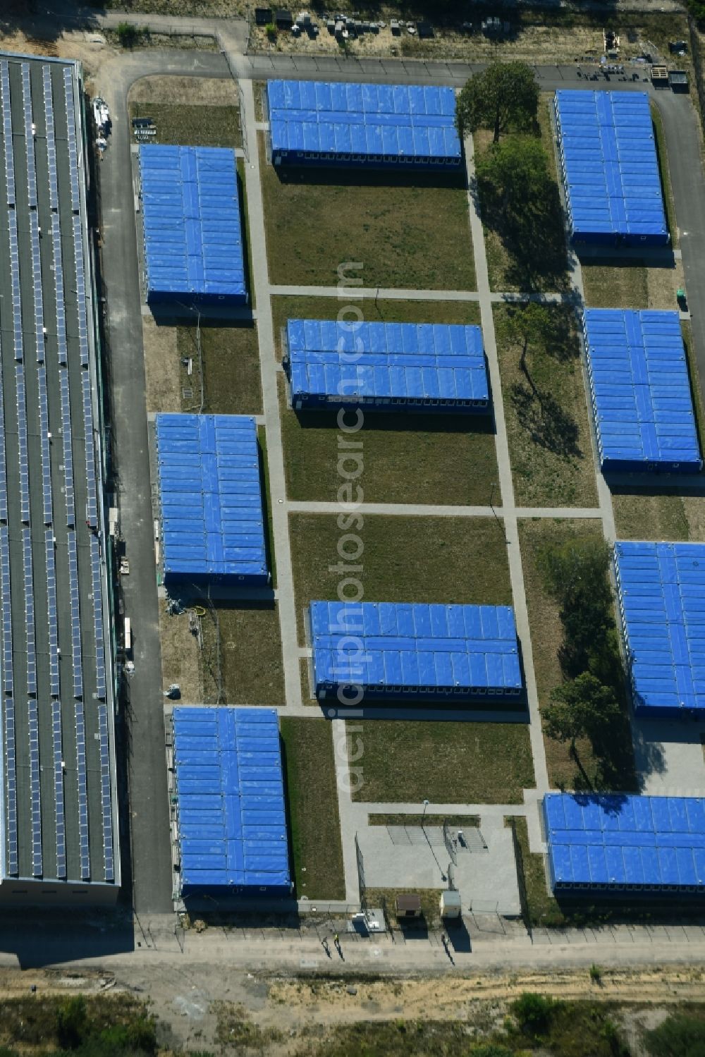 Zossen from the bird's eye view: Blue colored Container settlement as temporary shelter and reception center for refugees on Moscheestrasse in Zossen in the state Brandenburg