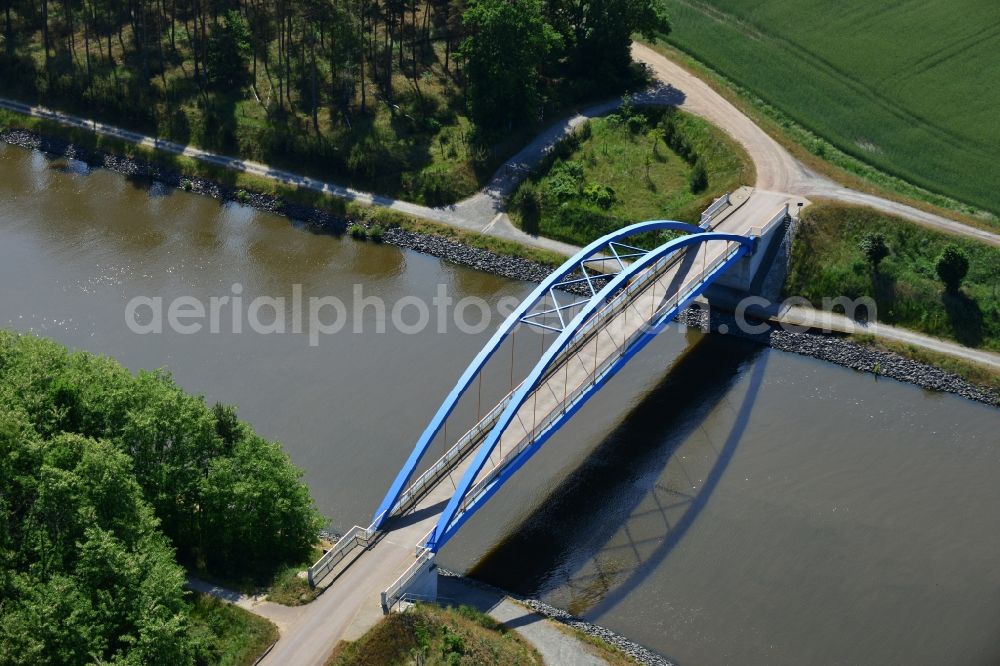 Burg (bei Magdeburg) from above - Blue bridge over the Elbe-Havel-Kanal at the gravel pit of Niegripp in the West of the town of Burg (bei Magdeburg) in the state of Saxony-Anhalt. The distinct blue arc bridge spans the canal in the West of the town. The bridge is surrounded by forest and is one of several bridges on the canal