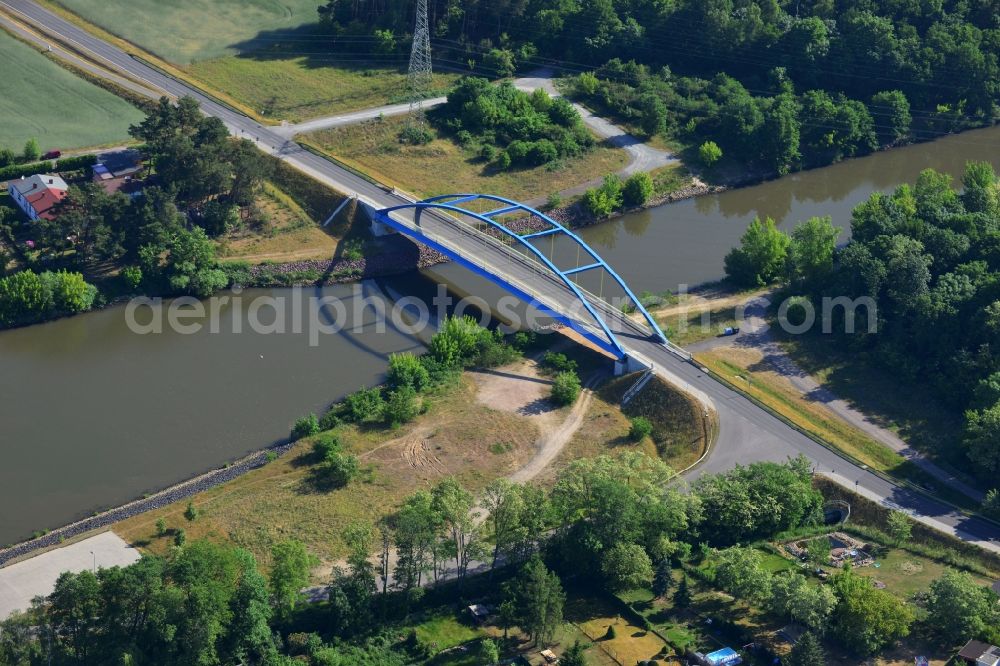 Aerial photograph Wusterwitz - Blue bridge in the North of Wusterwitz in the state of Brandenburg. The arc bridge spans the Elbe-Havel canal in the North of the village