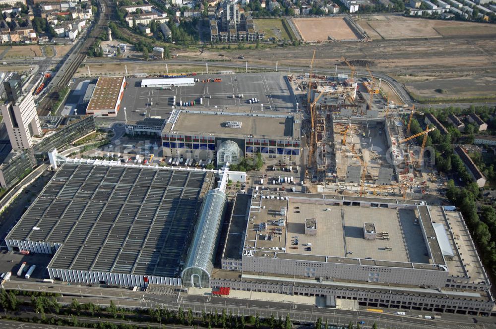 Frankfurt am Main from the bird's eye view: Blick auf das Messe- und Ausstellungsgelände mit Congress- und Festhalle sowie S-Bahnhof Messe. Im Westen des Geländes ensteht zur Zeit die neue Halle 11. Der Bau wird begleitet mit Webcams und Events. Frankfurt ist der drittgrößte Messeplatz der Welt. Adresse: Messe Frankfurt GmbH, Ludwig-Erhard-Anlage 1, 60327 Frankfurt a. M., Tel. +49 (0)69 75 75 0, Fax +49 (0)69 75 75 64 33