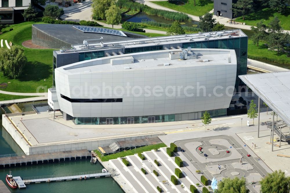 Aerial photograph Wolfsburg - View of the Autostadt Wolfsburg in Lower Saxony. The facility is a museum and theme park of the Volkswagen AG near the Volkswagen plant. Designed by the office of HENN architects and engineers and operated by the Autostadt GmbH, the park was opened in 2000