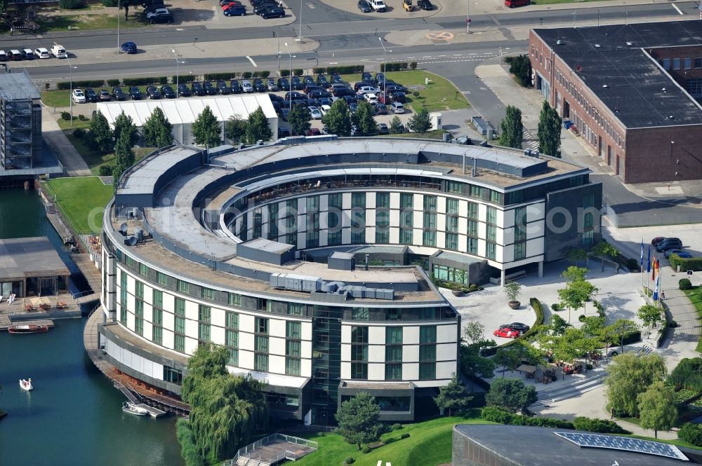 Wolfsburg from above - View of the Autostadt Wolfsburg in Lower Saxony. The facility is a museum and theme park of the Volkswagen AG near the Volkswagen plant. Designed by the office of HENN architects and engineers and operated by the Autostadt GmbH, the park was opened in 2000. The picture shows the hotel Ritz-Carlton of the venue