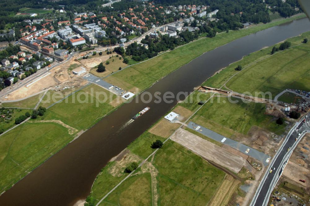 Aerial photograph Dresden - Blick auf die im Bau befindliche Waldschlösschenbrücke in Dresden. Das Bauvorhaben ist sehr umstritten, da die UNESCO bereits angedroht hat Dresden den Titel des Weltkulturerbes abzuerkennen, sollte der Bau der Brücke weitergeführt werden. Das Bautzner Oberverwaltungsgericht ordnete hingegen an die Brücke zu bauen, obwohl unklar ist ob dieses Vorhaben rechtens ist. Inzwischen wurden in der Planung der Brücke einige Änderungen vorgenommen. Der Bogen wird kleiner werden, die neue Planung sieht die Brücke einen Meter schmaler vor und die Füße werden nicht so wuchtig, sondern dezent ausfallen. Kontakt: Landeshauptstadt Dresden Stadtplanungsamt Abteilung Stadtplanung und Stadtgestaltung Frau Tauber, Postfach 120020 01001 Dresden, Technisches Rathaus, Hamburger Straße 19 01067 Dresden, 2. Etage, Zimmer 2042, Tel. +49(0)351 4883577, Fax +49(0)351 4883456, Email: bauleitplanung-altstadt-blasewitz@dresden.de; AWB Architekten Architekturbüro Bauer BDA, Blasewitzer Straße 78 01307 Dresden, Tel. +49(0)351 49709 0, Fax +49(0)351 49709 20