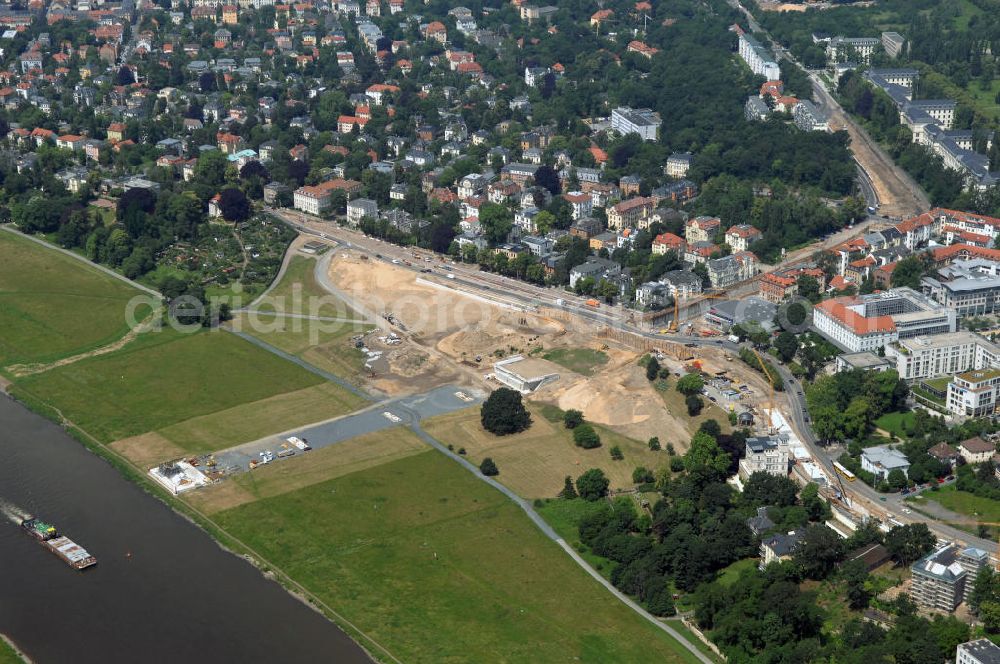 Dresden from the bird's eye view: Blick auf die im Bau befindliche Waldschlösschenbrücke in Dresden. Das Bauvorhaben ist sehr umstritten, da die UNESCO bereits angedroht hat Dresden den Titel des Weltkulturerbes abzuerkennen, sollte der Bau der Brücke weitergeführt werden. Das Bautzner Oberverwaltungsgericht ordnete hingegen an die Brücke zu bauen, obwohl unklar ist ob dieses Vorhaben rechtens ist. Inzwischen wurden in der Planung der Brücke einige Änderungen vorgenommen. Der Bogen wird kleiner werden, die neue Planung sieht die Brücke einen Meter schmaler vor und die Füße werden nicht so wuchtig, sondern dezent ausfallen. Kontakt: Landeshauptstadt Dresden Stadtplanungsamt Abteilung Stadtplanung und Stadtgestaltung Frau Tauber, Postfach 120020 01001 Dresden, Technisches Rathaus, Hamburger Straße 19 01067 Dresden, 2. Etage, Zimmer 2042, Tel. +49(0)351 4883577, Fax +49(0)351 4883456, Email: bauleitplanung-altstadt-blasewitz@dresden.de; AWB Architekten Architekturbüro Bauer BDA, Blasewitzer Straße 78 01307 Dresden, Tel. +49(0)351 49709 0, Fax +49(0)351 49709 20