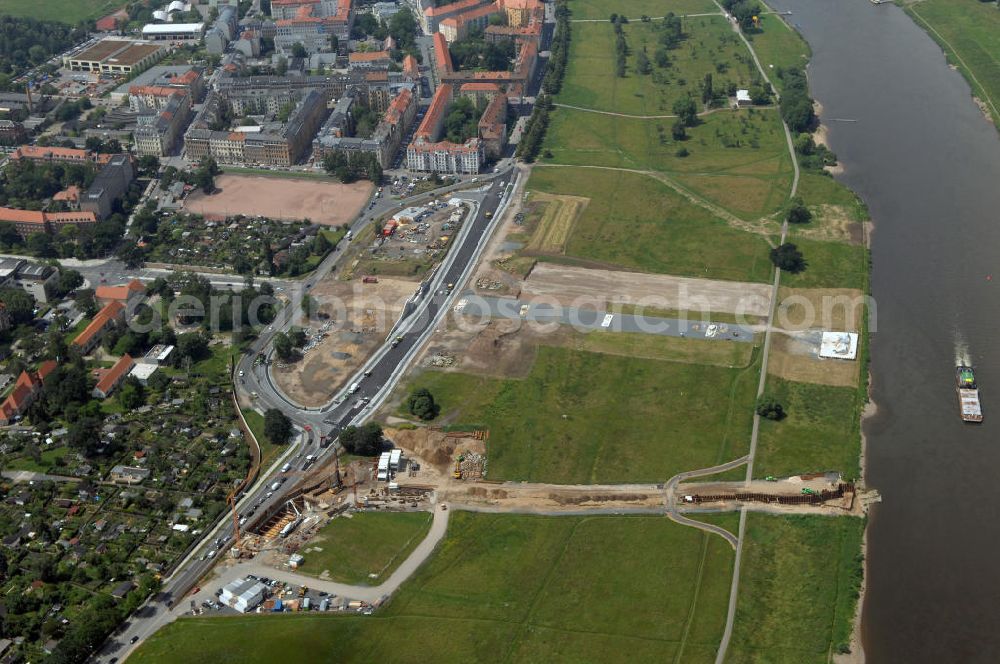 Aerial image Dresden - Blick auf die im Bau befindliche Waldschlösschenbrücke in Dresden. Das Bauvorhaben ist sehr umstritten, da die UNESCO bereits angedroht hat Dresden den Titel des Weltkulturerbes abzuerkennen, sollte der Bau der Brücke weitergeführt werden. Das Bautzner Oberverwaltungsgericht ordnete hingegen an die Brücke zu bauen, obwohl unklar ist ob dieses Vorhaben rechtens ist. Inzwischen wurden in der Planung der Brücke einige Änderungen vorgenommen. Der Bogen wird kleiner werden, die neue Planung sieht die Brücke einen Meter schmaler vor und die Füße werden nicht so wuchtig, sondern dezent ausfallen. Kontakt: Landeshauptstadt Dresden Stadtplanungsamt Abteilung Stadtplanung und Stadtgestaltung Frau Tauber, Postfach 120020 01001 Dresden, Technisches Rathaus, Hamburger Straße 19 01067 Dresden, 2. Etage, Zimmer 2042, Tel. +49(0)351 4883577, Fax +49(0)351 4883456, Email: bauleitplanung-altstadt-blasewitz@dresden.de; AWB Architekten Architekturbüro Bauer BDA, Blasewitzer Straße 78 01307 Dresden, Tel. +49(0)351 49709 0, Fax +49(0)351 49709 20