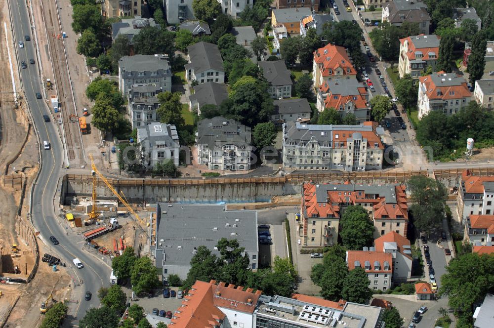 Dresden from the bird's eye view: Blick auf die im Bau befindliche Waldschlösschenbrücke in Dresden. Das Bauvorhaben ist sehr umstritten, da die UNESCO bereits angedroht hat Dresden den Titel des Weltkulturerbes abzuerkennen, sollte der Bau der Brücke weitergeführt werden. Das Bautzner Oberverwaltungsgericht ordnete hingegen an die Brücke zu bauen, obwohl unklar ist ob dieses Vorhaben rechtens ist. Inzwischen wurden in der Planung der Brücke einige Änderungen vorgenommen. Der Bogen wird kleiner werden, die neue Planung sieht die Brücke einen Meter schmaler vor und die Füße werden nicht so wuchtig, sondern dezent ausfallen. Kontakt: Landeshauptstadt Dresden Stadtplanungsamt Abteilung Stadtplanung und Stadtgestaltung Frau Tauber, Postfach 120020 01001 Dresden, Technisches Rathaus, Hamburger Straße 19 01067 Dresden, 2. Etage, Zimmer 2042, Tel. +49(0)351 4883577, Fax +49(0)351 4883456, Email: bauleitplanung-altstadt-blasewitz@dresden.de; AWB Architekten Architekturbüro Bauer BDA, Blasewitzer Straße 78 01307 Dresden, Tel. +49(0)351 49709 0, Fax +49(0)351 49709 20