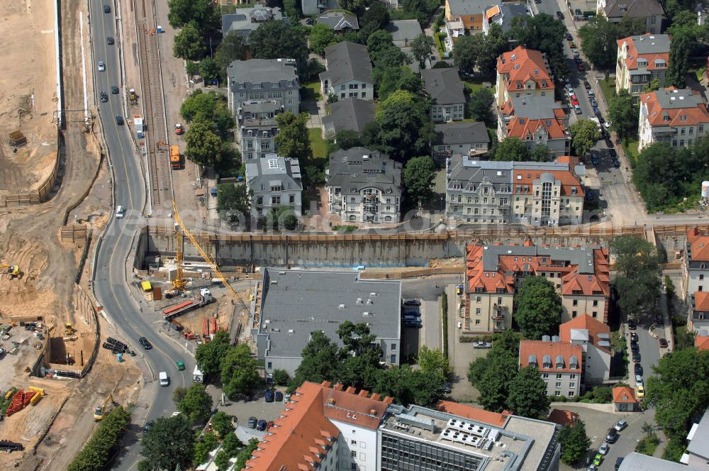 Dresden from the bird's eye view: Blick auf die im Bau befindliche Waldschlösschenbrücke in Dresden. Das Bauvorhaben ist sehr umstritten, da die UNESCO bereits angedroht hat Dresden den Titel des Weltkulturerbes abzuerkennen, sollte der Bau der Brücke weitergeführt werden. Das Bautzner Oberverwaltungsgericht ordnete hingegen an die Brücke zu bauen, obwohl unklar ist ob dieses Vorhaben rechtens ist. Inzwischen wurden in der Planung der Brücke einige Änderungen vorgenommen. Der Bogen wird kleiner werden, die neue Planung sieht die Brücke einen Meter schmaler vor und die Füße werden nicht so wuchtig, sondern dezent ausfallen. Kontakt: Landeshauptstadt Dresden Stadtplanungsamt Abteilung Stadtplanung und Stadtgestaltung Frau Tauber, Postfach 120020 01001 Dresden, Technisches Rathaus, Hamburger Straße 19 01067 Dresden, 2. Etage, Zimmer 2042, Tel. +49(0)351 4883577, Fax +49(0)351 4883456, Email: bauleitplanung-altstadt-blasewitz@dresden.de; AWB Architekten Architekturbüro Bauer BDA, Blasewitzer Straße 78 01307 Dresden, Tel. +49(0)351 49709 0, Fax +49(0)351 49709 20