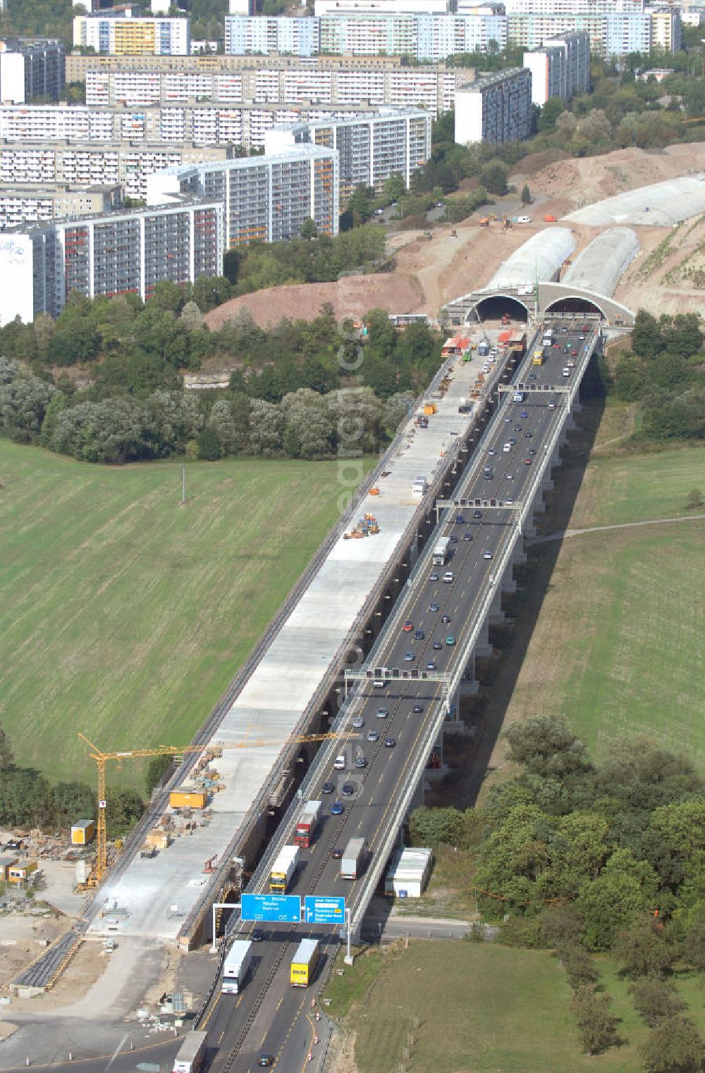 Aerial photograph Jena - Blick auf die Baustelle der Autobahn 4 in Jena Göschwitz. Die Bauarbeiten haben im Jahr 2004 begonnen. Ziel ist der Ausbau zu einer sechsspurigen Autobahn und die Lärmminderung durch die Eintunnelung eines Teilstückes der Autobahn. Außerdem entstand mit 5 Meter Abstand eine zweite Brücke neben der denkmalgeschützten Saalebrücke. Kontakt: Ingenieurgruppe BEB GmbH, Über der Nonnenwiese 7 99428 Weimar, Tel. +49(0)3643 7466 0, Fax +49(0)3643 7466 29, Email: kontakt@beb-weimar.de