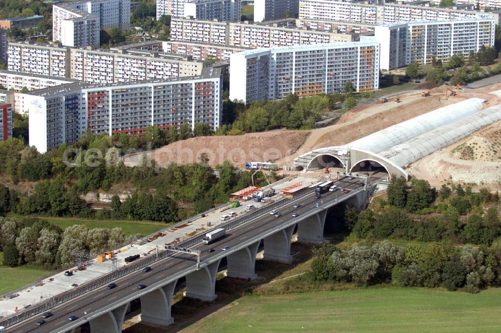 Aerial image Jena - Blick auf die Baustelle der Autobahn 4 in Jena Göschwitz. Die Bauarbeiten haben im Jahr 2004 begonnen. Ziel ist der Ausbau zu einer sechsspurigen Autobahn und die Lärmminderung durch die Eintunnelung eines Teilstückes der Autobahn. Außerdem entstand mit 5 Meter Abstand eine zweite Brücke neben der denkmalgeschützten Saalebrücke. Kontakt: Ingenieurgruppe BEB GmbH, Über der Nonnenwiese 7 99428 Weimar, Tel. +49(0)3643 7466 0, Fax +49(0)3643 7466 29, Email: kontakt@beb-weimar.de