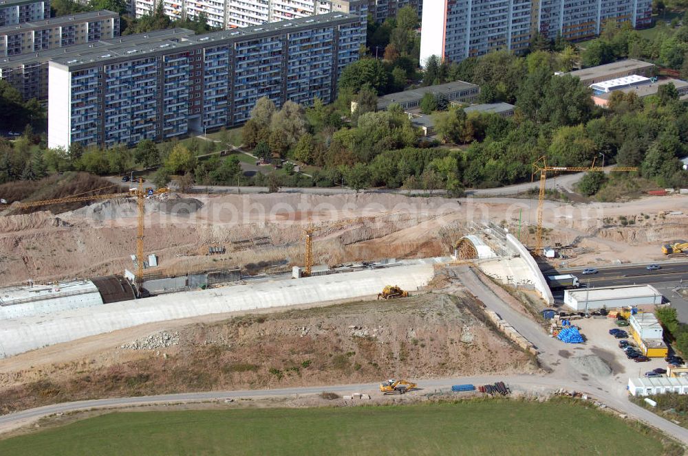 Aerial photograph Jena - Blick auf die Baustelle der Autobahn 4 in Jena Göschwitz. Die Bauarbeiten haben im Jahr 2004 begonnen. Ziel ist der Ausbau zu einer sechsspurigen Autobahn und die Lärmminderung durch die Eintunnelung eines Teilstückes der Autobahn. Außerdem entstand mit 5 Meter Abstand eine zweite Brücke neben der denkmalgeschützten Saalebrücke. Kontakt: Ingenieurgruppe BEB GmbH, Über der Nonnenwiese 7 99428 Weimar, Tel. +49(0)3643 7466 0, Fax +49(0)3643 7466 29, Email: kontakt@beb-weimar.de