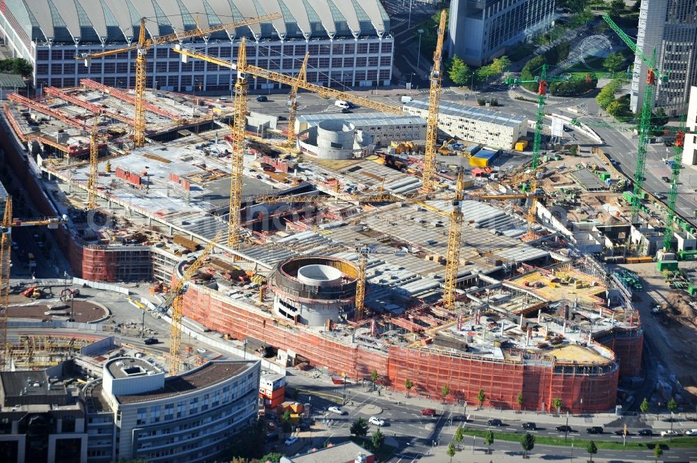 Frankfurt am Main from above - View of the construction site of the shopping center of the complex Skyline Plaza in Frankfurt. The construction began in June 2011, the opening is scheduled for autumn 2013. The building, which will cost € 320 million and have a sales area of 38,000 square kilometers, is designed of the shopping center specialist ECE Group and CA Immo. It is built by the Max Bögl Construction GmbH & Co in cooperation with bam Deutschland. KG. The architects office Jourdan and Müller also plans, in addition to the undulating facade of the five-storey building, Frankfurt's largest beer garden on the roof of the shopping center