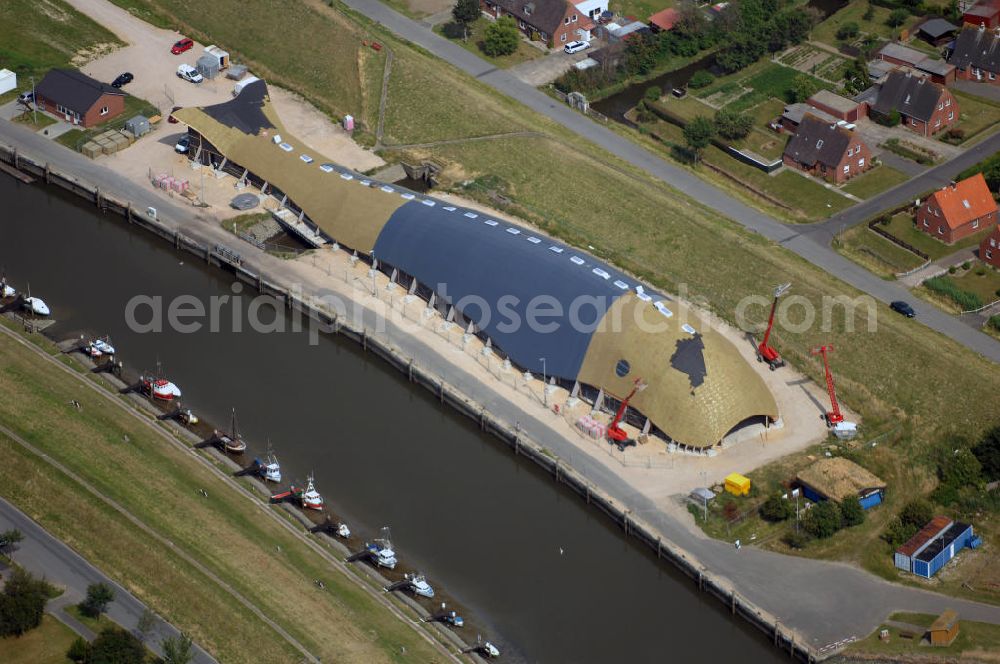 Friedrichskoog from the bird's eye view: Blick auf eine Baustelle für eine Indoor - Spielhalle in Friedrichskoog. DIe Freizeit - Spielhalle in Form eines Wals kostet 3 Mio. Euro. Richtfest war im Mai 2008. Architekt: rimpf Architektur, Rosengang 4, 24340 Eckernförde, Tel. +49 (0)4351 7172 0, Fax +49 (0)4351 7172 73, Email info@rimpf.de