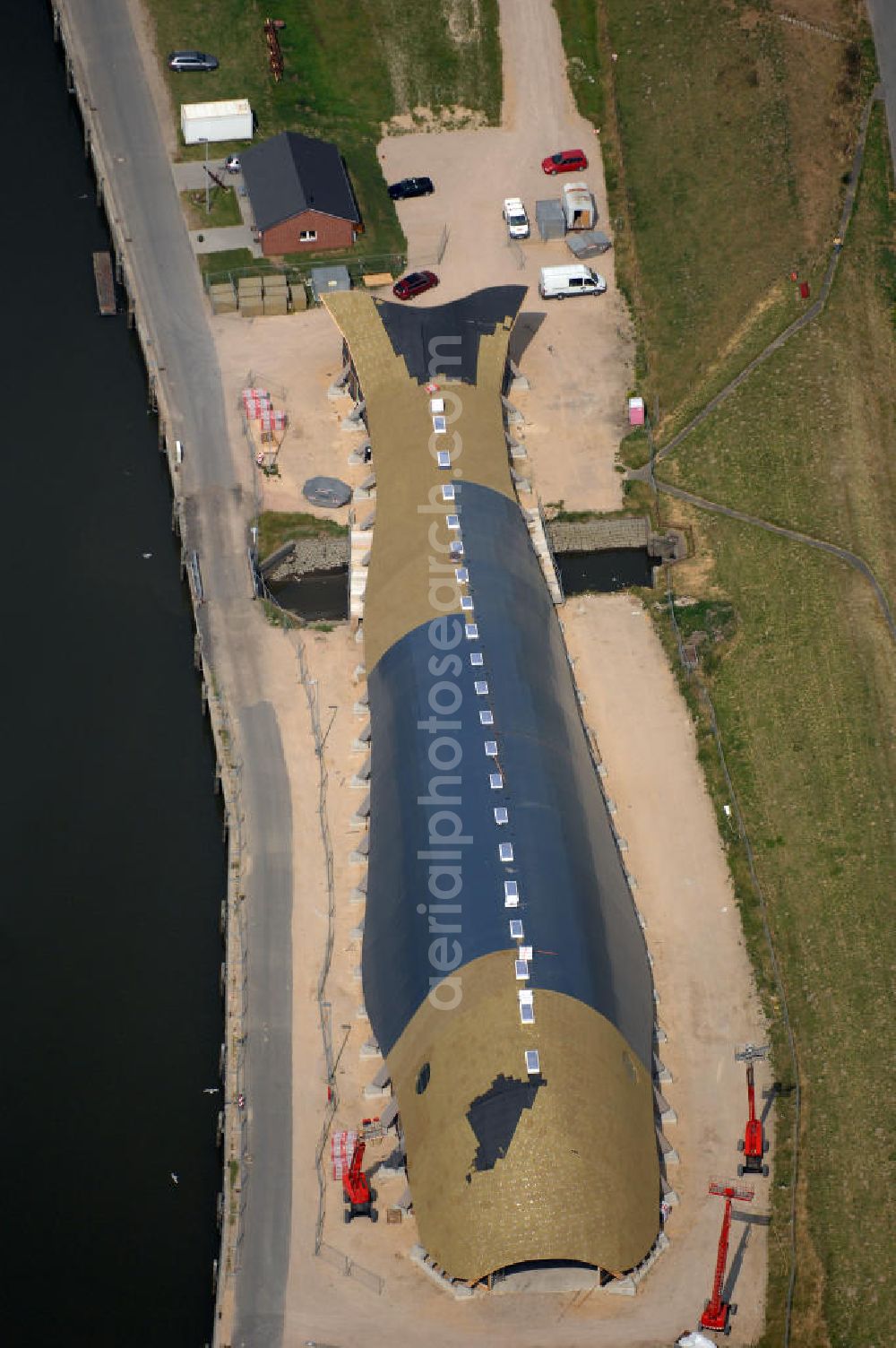 Friedrichskoog from above - Blick auf eine Baustelle für eine Indoor - Spielhalle in Friedrichskoog. DIe Freizeit - Spielhalle in Form eines Wals kostet 3 Mio. Euro. Richtfest war im Mai 2008. Architekt: rimpf Architektur, Rosengang 4, 24340 Eckernförde, Tel. +49 (0)4351 7172 0, Fax +49 (0)4351 7172 73, Email info@rimpf.de