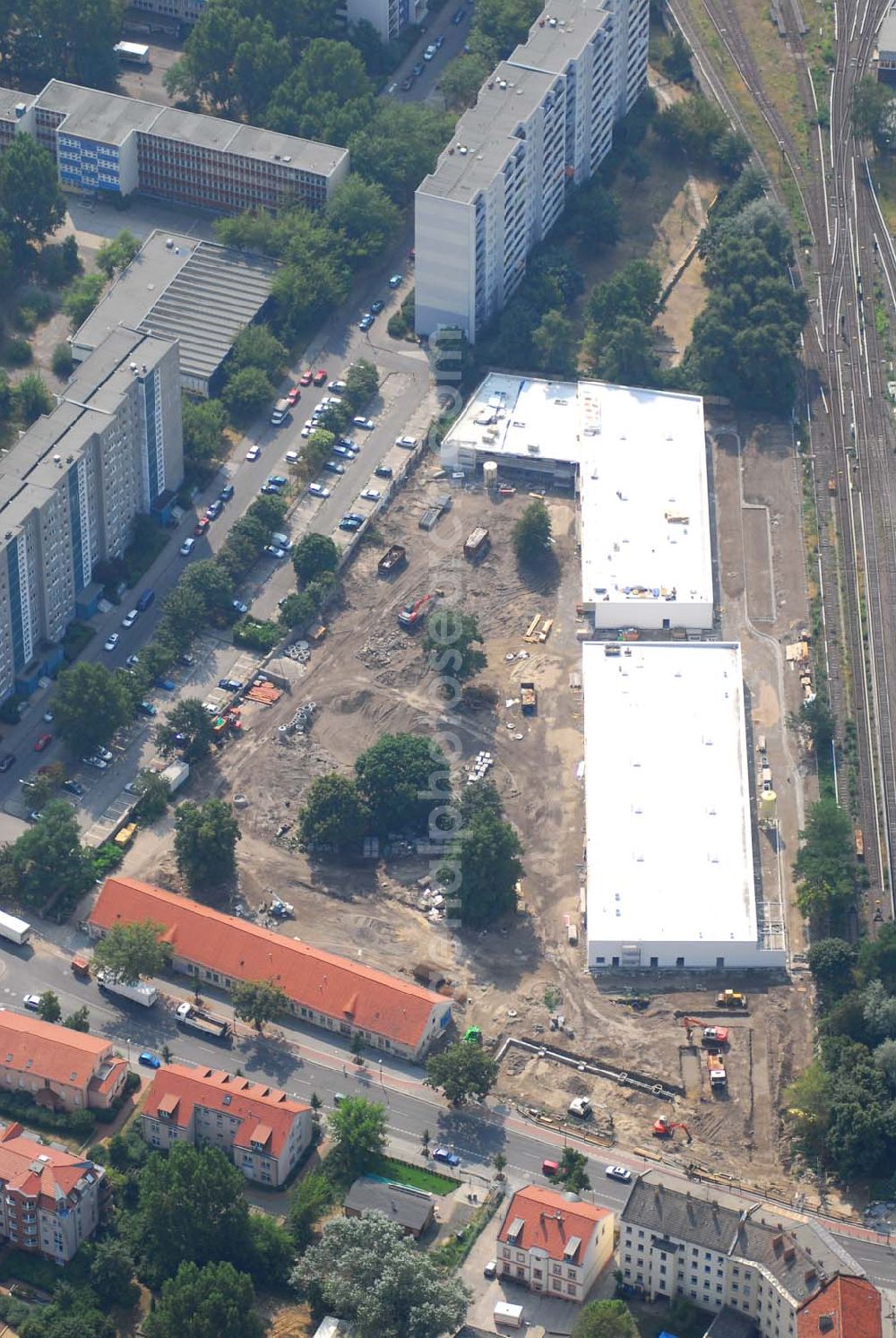 Berlin from the bird's eye view: Blick auf die Baustelle des Market Stadtteilzentrums an der Alfred-Kowalke-Straße in Berlin-Lichtenberg. Beteiligte Firmen: GWB Gesellschaft für Geschäfts- und Wohnbauten mbH und Co. KG, Hauptstr. 1a, 22962 Siek, Tel.: 01407/908061 Bauleitung: PLK Städtebau, Winsstr. 53, 10405 Berlin, Tel.: 030/39071460 Baufirma: STRABAG Hoch- und Ingenieurbau AG, Bessemer Str. 42b, 12103 Berlin, Dipl.-Ing. Peter Dörges, Tel.: +49 (0)30 / 754 77-0, eMail: peter.doerges@strabag.de