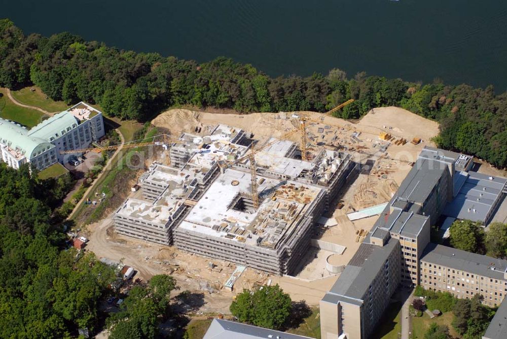 Aerial image Rüdersdorf - Blick auf die Baustelle des Krankenhaus Neubaus des Evangelisch-Freikirchlichen Krankenhaus Rüdersdorf. Rechts neben der Baustelle steht das alte Bettenhaus mit sämtlichen Nebengebäuden aus den 60er-Jahren, welches nach dem Umzug in das neue Gebäude abgerissen wird. Auf dem Gelände wird dann der Park des Krankenhauses entstehen, u. a. mit einem Kinderspielplatz und Medizinalkräutergarten. Das neue drei- und viergeschossige Krankenhaus hat eine Kapazität für 287 Betten in 135 Patientenzimmern. Kontakt: Krankenhaus und Poliklinik Rüdersdorf GmbH, Seebad 82/83, 15562 Rüdersdorf, Tel. +49(0)33638 83 0, Fax +49(0)33638 83 228, E-Mail: info @krankenhaus-ruedersdorf.de; Kontakt: Immanuel Diakonie GmbH (Holding), Am Kleinen Wannsee 5, 14109 Berlin, Tel. +490)30 80505 272, Fax +490)30 80505 266, E-Mail: mail@immanuel.de