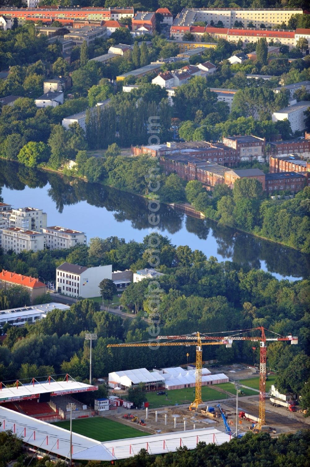 Aerial image Berlin - View of the construction site at the stadium An der Alten Förste in Berlin. The football stadium in Köpenick in the district of Treptow-Koepenick was opened in 1920 and has served as the home stadium of the 1st FC Union Berlin. In May 2012 the old main stand was demolished and a new building began. It should be built a new grandstand with 3,700 seats and 38 boxes, and new parking spaces for a total of 17 million €. The costs are borne by the State of Berlin, by the association and by debts