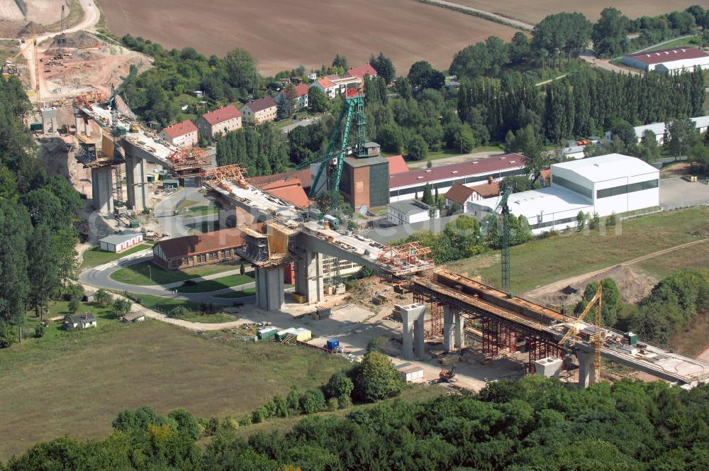 Aerial photograph Sollstedt - Blick auf die Baustelle zur Bundesautobahn A38 bei Sollstedt. Momentan wird u. a. bei Sollstedt die Bundesautobahn A38 gebaut. Sie ist eines der Verkehrsprojekte Deutsche Einheit und soll eine Verbindung von Halle/Leipzig zum Ruhrgebiet herstellen. Hierbei durchläuft sie die Bundesländer Niedersachsen, Hessen, Thüringen, Sachsen-Anhalt sowie Sachsen. Die Gesamtlänge der Autobahn beläuft sich auf 208 km. Kontakt: DEGES Deutsche Einheit Fernstraßenplanungs- und -bau GmbH, Öffentlichkeitsarbeit, Zimmerstraße 54, 10117 Berlin, Tel.: +49(0)30 202 43 352, Fax: 030-202 43 591, E-Mail: info@deges.de