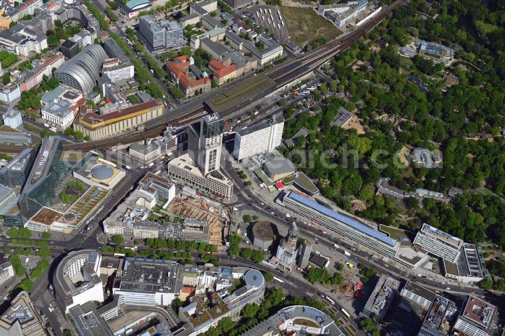 Aerial image Berlin - The Breitscheidplatz with the Kaiser Wilhelm Memorial Church, Europa Center, the Weltkugelbrunnen the renovated bikini-house in the Budapesterstrasse forms the heart of the city west of Berlin in the district of Charlottenburg. With the Zoologischer Garten station this Carré has a representative transport links. The Zoological Garden is one of the main attractions of the capital. The highest house on the square is the skyscraper Zoofenster with the luxury Waldorf Astoria Hotel. The internationally famous cinema Zoopalast and the theater of the West are here. In recent years, many new residential and commercial buildings were built. Compared with the currently Zoopalast arises another skyscraper - the Atlas Tower. The client is the Strabag Real Estate. The Cafe Kranzler is a popular eatery