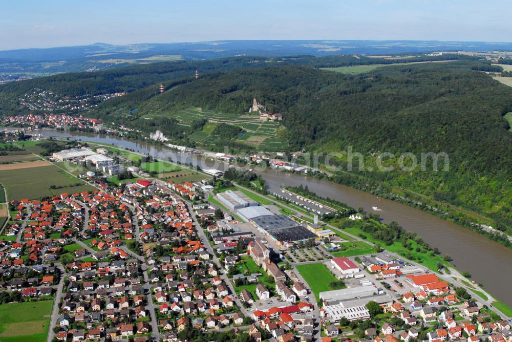 Aerial photograph Haßmersheim - Blick über Haßmersheim. Zur Gemeinde zählen seit 1972 auch die Ortsteile Neckarmühlbach und Hochhausen. Sie liegt im Neckartal am Rande des Neckar-Odenwald-Kreises in Baden-Württemberg. erstmals erwähnt wurde der Ort am 07. Juni 774. Am oberen Bildrand ist der Neckar zu sehen. Kontakt: Rathaus, Theodor-Heuss-Straße 45 74855 Haßmersheim Necker-Odenwald-Kreis, Tel. +49(0)6266 791 0, Fax +49(0)6266 791 40, Email: post@hassmersheim.de