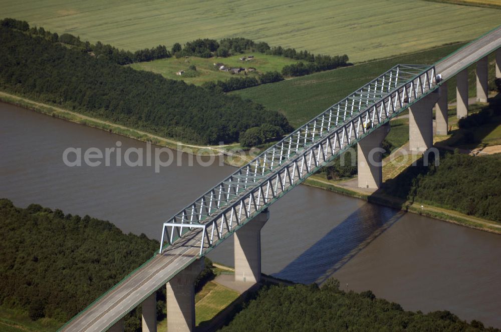 Aerial photograph Brunsbüttel - Blick auf die Hochbrücke bei Brunsbüttel. Die Hochbrücke Brunsbüttel ist mit 2831 m die längste Brücke über den Nord-Ostsee-Kanal und gehört damit auch zu den längsten Brücken Deutschlands. Das Bauwerk ist Bestandteil der Bundesstraße 5 und liegt östlich von Brunsbüttel.