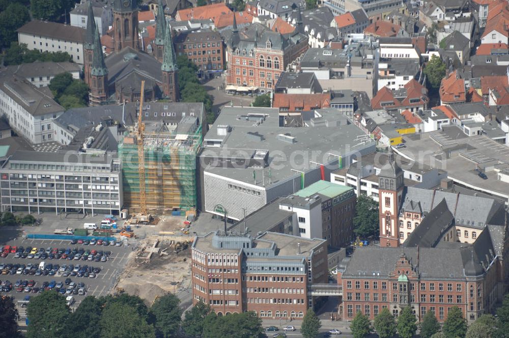 Aerial image Oldenburg - Blick über die Oldenburger Innenstadt. Zu sehen sind das Kaufhaus Galeria Kaufhof mit Parkhaus, die evangelisch-lutherische Kirche sowie ein denkmalgeschütztes Gebäude im Vordergrund, in dem die Deutsche Telekom ansässig ist.