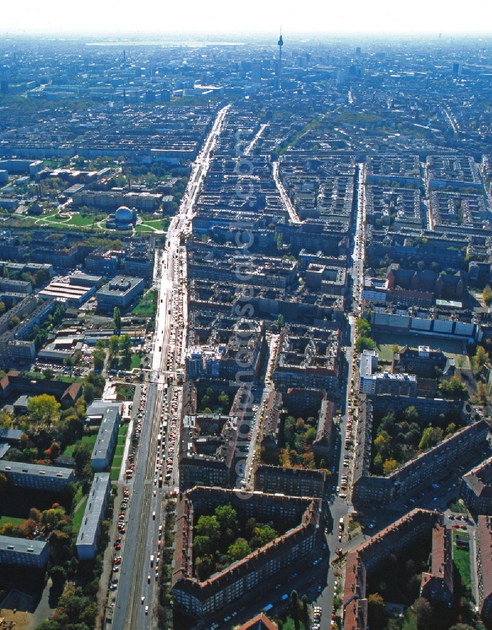 Aerial photograph Berlin - View over the Prenzlauer Allee towards Berlin TV tower at Alexanderplatz in Berlin. In the upper part of the Zeiss Planetarium is seen