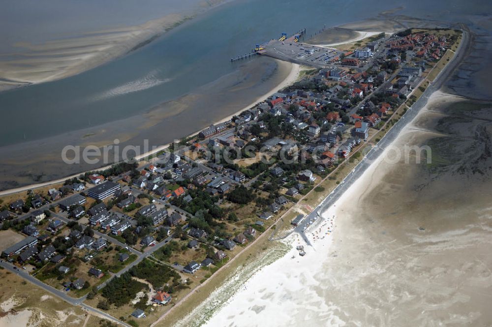 Aerial photograph Wittdün - Blick über Wittdün auf Amrum auf den Seezeichenhafen. Durch den Tonnenanleger werden dort Seezeichen gepflegt und im Fahrwasser ausgelegt. In diesem Hafen legen außerdem ein Rettungskreuzer, Fischkutter, Ausflugsschiffe und Yachten an. Wittdün ist neben Nebel und Norddorf eine der drei Gemeinden auf der Nordseeinsel Amrum. Wittdün ist ein Seeheilbad. Der Tourismus ist die Haupteinnahmequelle. Kontakt: Amt Föhr-Amrum, Hafenstraße 23, 25938 Wyk auf Föhr, Daniel Schenck Tel. +49 (0)4681 5004 824