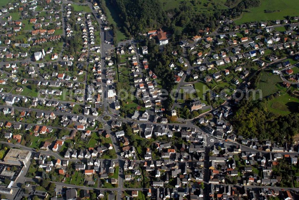 Aßlar from the bird's eye view: Berghausen ist ein Stadtteil der Stadt Aßlar nahe Wetzlar im Lahn-Dill-Kreis in Hessen. Es liegt auf einem Ausläufer des Gebirges Westerwald sowie nahe dem Fluss Dill, der im nahen Wetzlar in die Lahn mündet