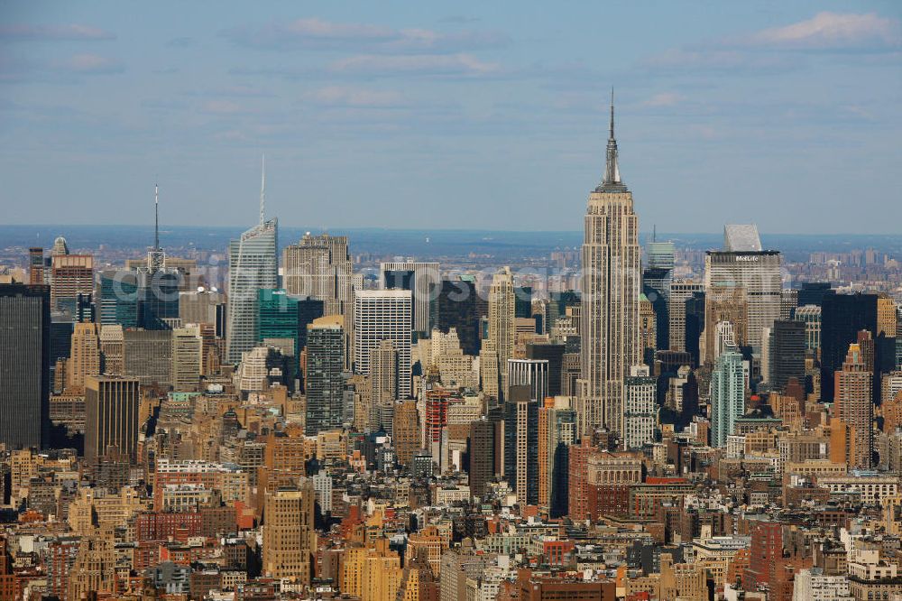 New York from above - View of the Midtown district in Manhattan, New York. Midtown Manhattan is an important financial district in New York City and the largest business center of the United States. Significant buildings include the Rockefeller Center, the Empire State Building and the Bank of America Tower