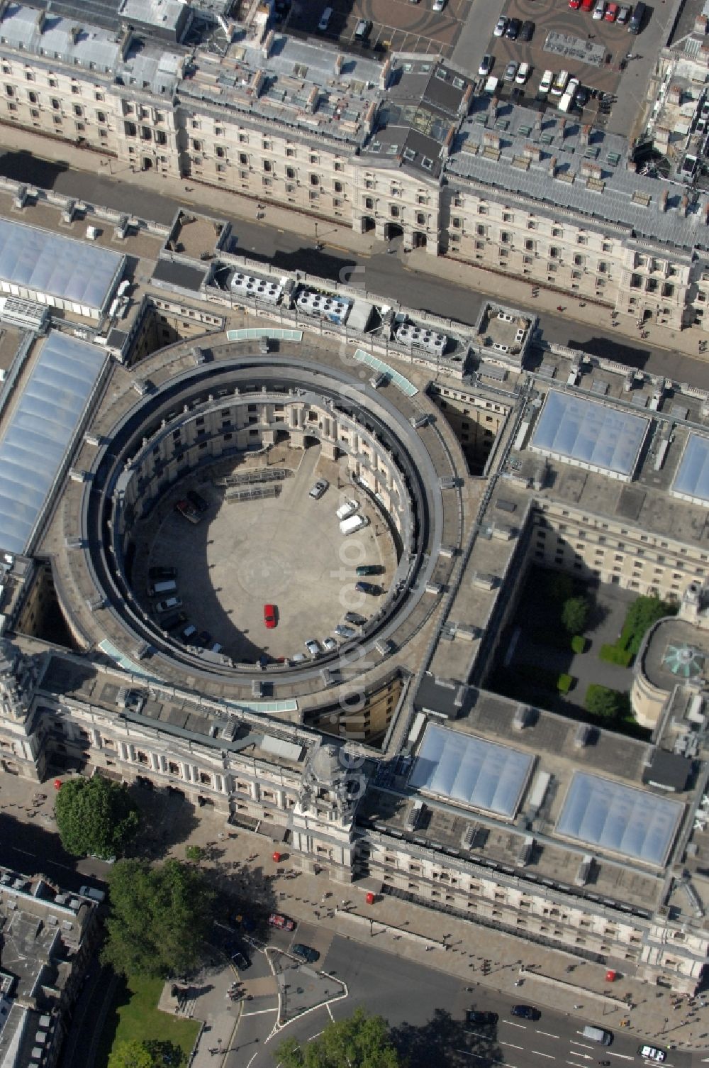 London from the bird's eye view: View on the circular building Her Majesty's Treasury, which is the British government department for public finance and economic policy in London. The ministry and old tourist attraction, which was constructed in 1126, is managed by the Chancellor of the Exchequer and has detailed output lists