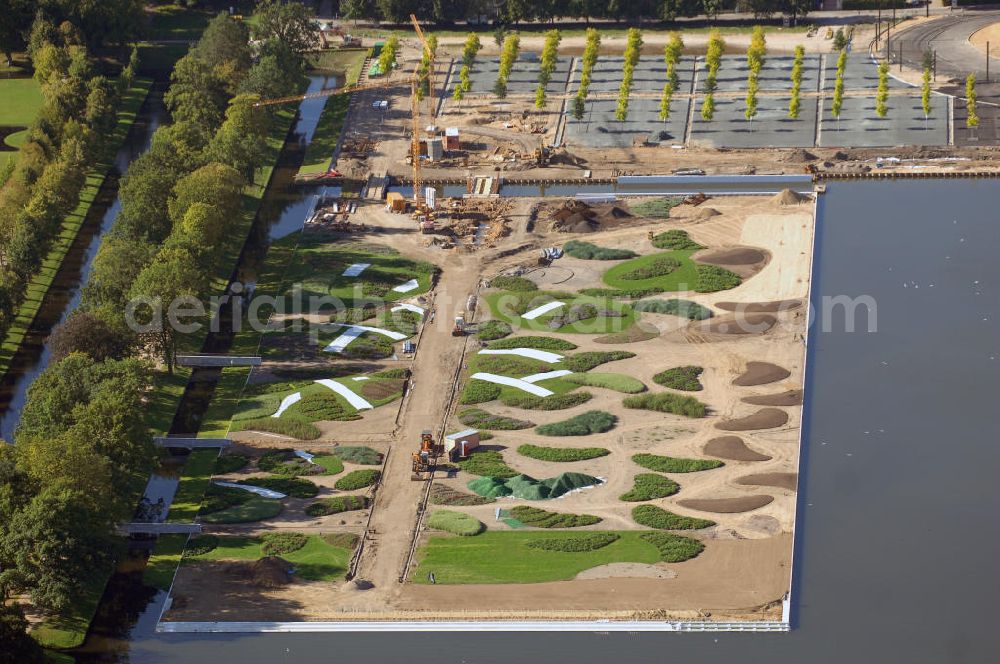 Schwerin from above - Blick auf das BUGA 2009 - Gelände rund um den Schweriner See. Im Mittelpunkt der Bundesgartenschau, welche 2009 zum zweiten Mal in Mecklenburg-Vorpommern stattfindet, steht die geschichtliche Entwicklung der Gartenbaukunst. Die Ausstellungsareale sammeln sich kompakt um das Schweriner Schloss bzw. die Altstadt. Die insgesamt sieben Gärten, welche alle in Wassernähe liegen, werden durch eine Vielzahl von Umlandprojekten in ganz Mecklenburg-Vorpommern ergänzt. Die BUGA 2009 findet auf einer Gesamtfläche von 550.000 qm statt und kostet 72,2 Mio. Euro. Kontakt: Bundesgartenschau Schwerin 2009 GmbH, Eckdrift 43 - 45, 19061 Schwerin, Tel. +49 (0)385 2009 0, Fax +49 (0)385 2009 111, EMail info@buga-2009.de