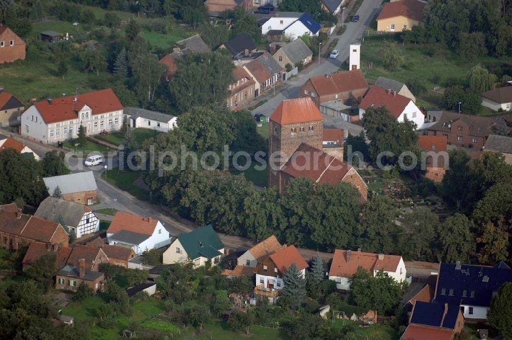 Aerial photograph Redekin - Blick auf die Dorfkirche. Sie ist eine der Kirchen, die zur Straße der Romanik zählt. Diese Straße verbindet die Dome, Burgen, Klöster und Kirchen, die in der Zeit vom 10. bis Mitte des 13. Jahrhundert entstanden, und somit ein Zeichen der Christianisierung sind. Kontakt: Pfarrerin i. R. Schwarzkopf, Wilhelm-Külz-Straße 9, 39319 Redekin, Tel.: 039341-50108