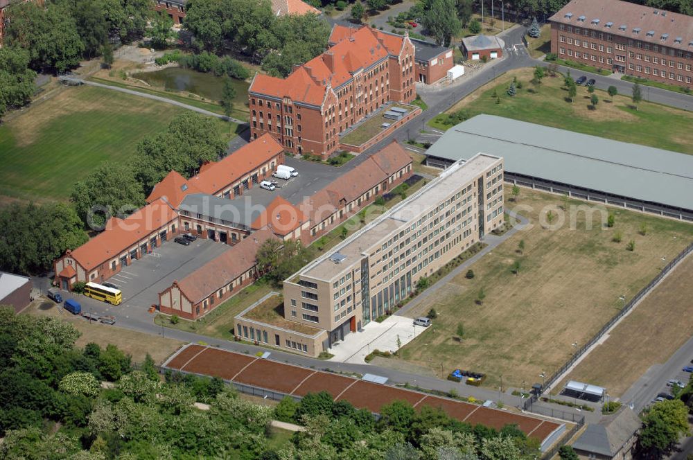 Aerial photograph Berlin - Blick auf das ehemalige Kasernengelände Am Treptower Park in Berlin. Das Kasernengelände Am Treptower Park in Berlin-Alt-Treptow wurde 1908 für das Königliche Telegraphen-Bataillon Nr. 1 gebaut. Heute wird es vom Bundeskriminalamt genutzt. Seit Dezember 2004 ist auf dem Gelände außerdem noch das Gemeinsame Terrorismusabwehrzentrum von BKA und Bundesamt für Verfassungsschutz angesiedelt. Adresse: Bundeskriminalamt Berlin, Am Treptower Park 5–8, 13220 Berlin, Zentrale: Bundeskriminalamt, 65173 Wiesbaden, Tel. +49 (0)611 55 0, Fax +49 (0)611 55 12141, EMail info@bka.de