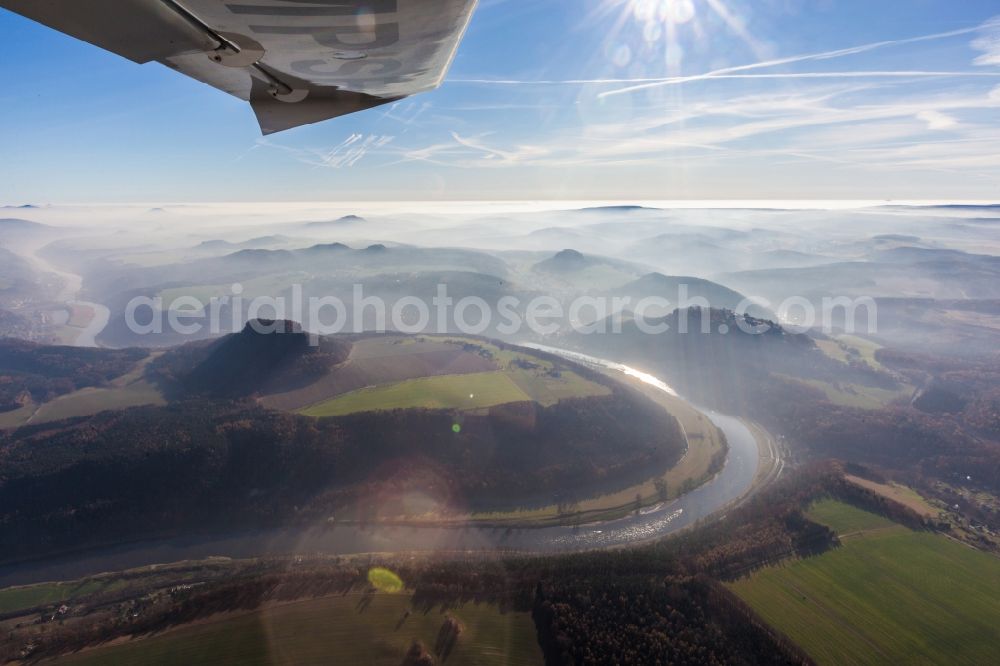 Königstein from the bird's eye view: Flight through the early morning fog enveloped with Elbe valley in Saxon Switzerland in Königstein in Saxony