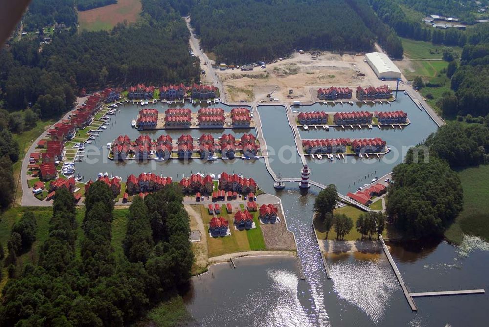 Rheinsberg from the bird's eye view: Blick auf das fast fertige Hafendorf Rheinsberg - Projektgesellschaft Hafendorf Rheinsberg GmbH,Lenaustr. 27,D-12305 Berlin,Telefon: +49 33931/34 161,Telefax: +49 33931/34 163,Email: info@hafendorf-rheinsberg.de,Achim Walder: