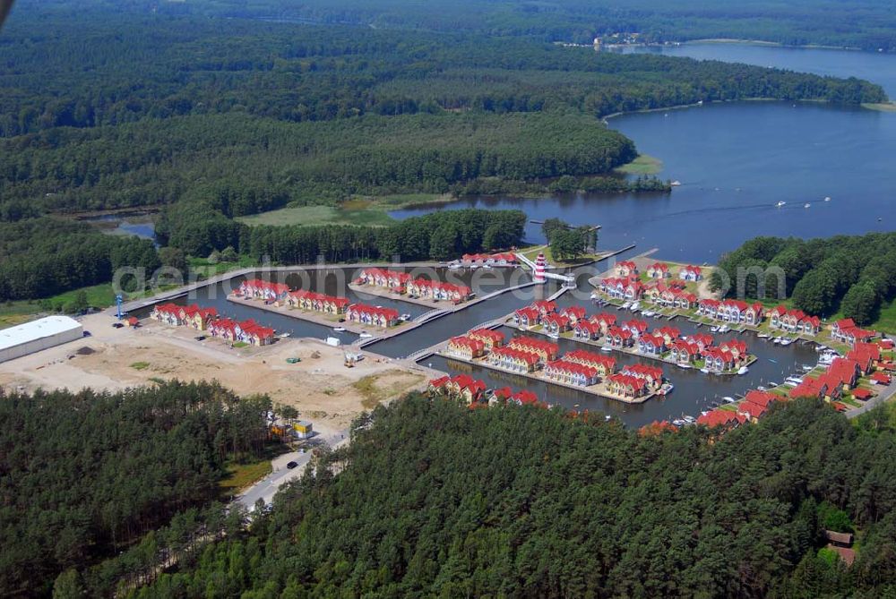 Rheinsberg from the bird's eye view: Blick auf das fast fertige Hafendorf Rheinsberg - Projektgesellschaft Hafendorf Rheinsberg GmbH,Lenaustr. 27,D-12305 Berlin,Telefon: +49 33931/34 161,Telefax: +49 33931/34 163,Email: info@hafendorf-rheinsberg.de,Achim Walder: