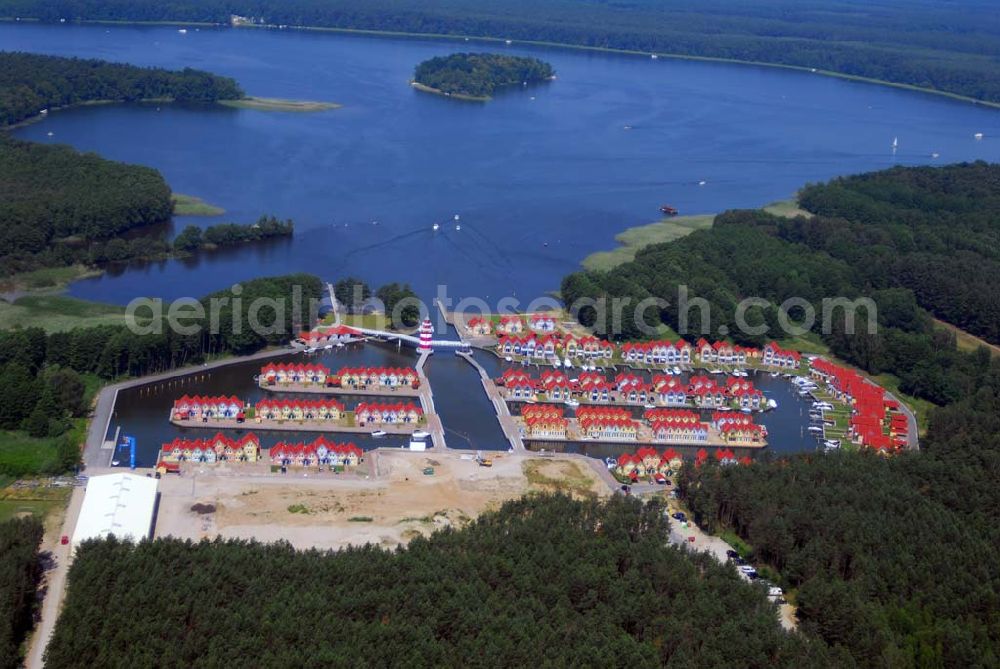 Rheinsberg from the bird's eye view: Blick auf das fast fertige Hafendorf Rheinsberg - Projektgesellschaft Hafendorf Rheinsberg GmbH,Lenaustr. 27,D-12305 Berlin,Telefon: +49 33931/34 161,Telefax: +49 33931/34 163,Email: info@hafendorf-rheinsberg.de,Achim Walder: