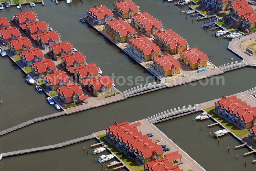 Rheinsberg from the bird's eye view: Blick auf das fast fertige Hafendorf Rheinsberg - Projektgesellschaft Hafendorf Rheinsberg GmbH,Lenaustr. 27,D-12305 Berlin,Telefon: +49 33931/34 161,Telefax: +49 33931/34 163,Email: info@hafendorf-rheinsberg.de,Achim Walder: