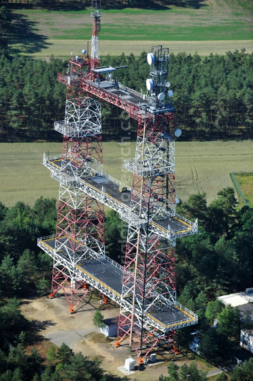 Aerial photograph Gusborn - View of the telecommunications tower Torii Tower near Gusborn in Lower Saxony. The 1972 built steel lattice tower is designed as a twin-tower and was made ??in the USA. While it originally served as a listening post, it is now an antenna support for public safety and mobile phones