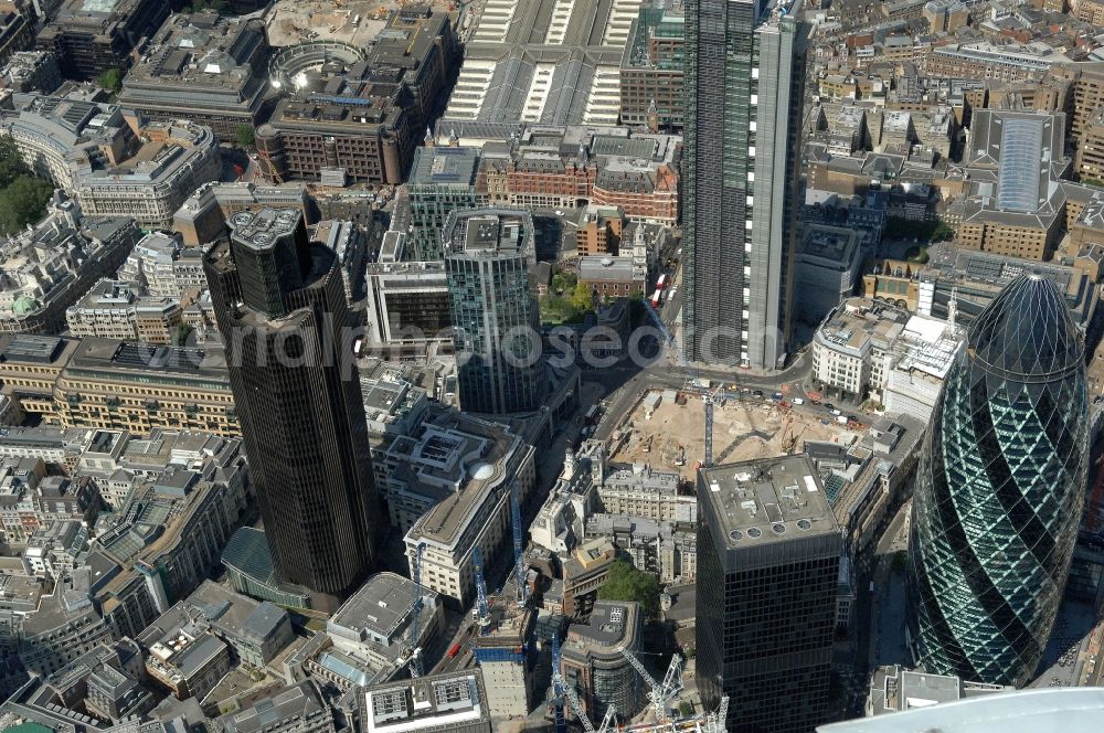 London from above - View of the financial district of the City of London, London. On display are several skyscrapers, like the 2004-based 180-meter high skyscraper 30 St Mary Axe, and the 183 meters high tower Tower 42, which was completed in 1980