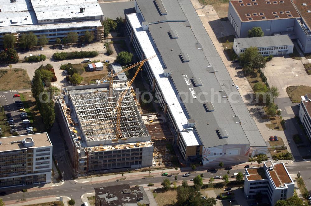 Aerial image Berlin - Blick auf das Firmengelände der Studio Berlin Adlershof (SBA) GmbH mit Baustelle in Berlin Adlershof. Das Unternehmen ist Dienstleister für Drehbuchentwicklung, Bühnenbau, Fernsehproduktionen, digitale Postproduktion, uvm. Kontakt: Studio Berlin Adlershof (SBA) GmbH, Am Studio 20, 12489 Berlin, Tel. +49 (0)30 67 04 55 00, Fax +49 (0)30 67 04 55 05, info@studio-berlin.de